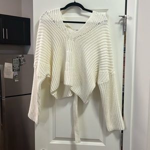 White long sleeve sweater with tie in the back